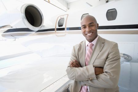 Businessman,On,Trip,With,Executive,Jet,Airplane,In,Hangar
